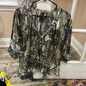 Multi grey colored v neck blouse with oversized arms and a clenched waist inseam